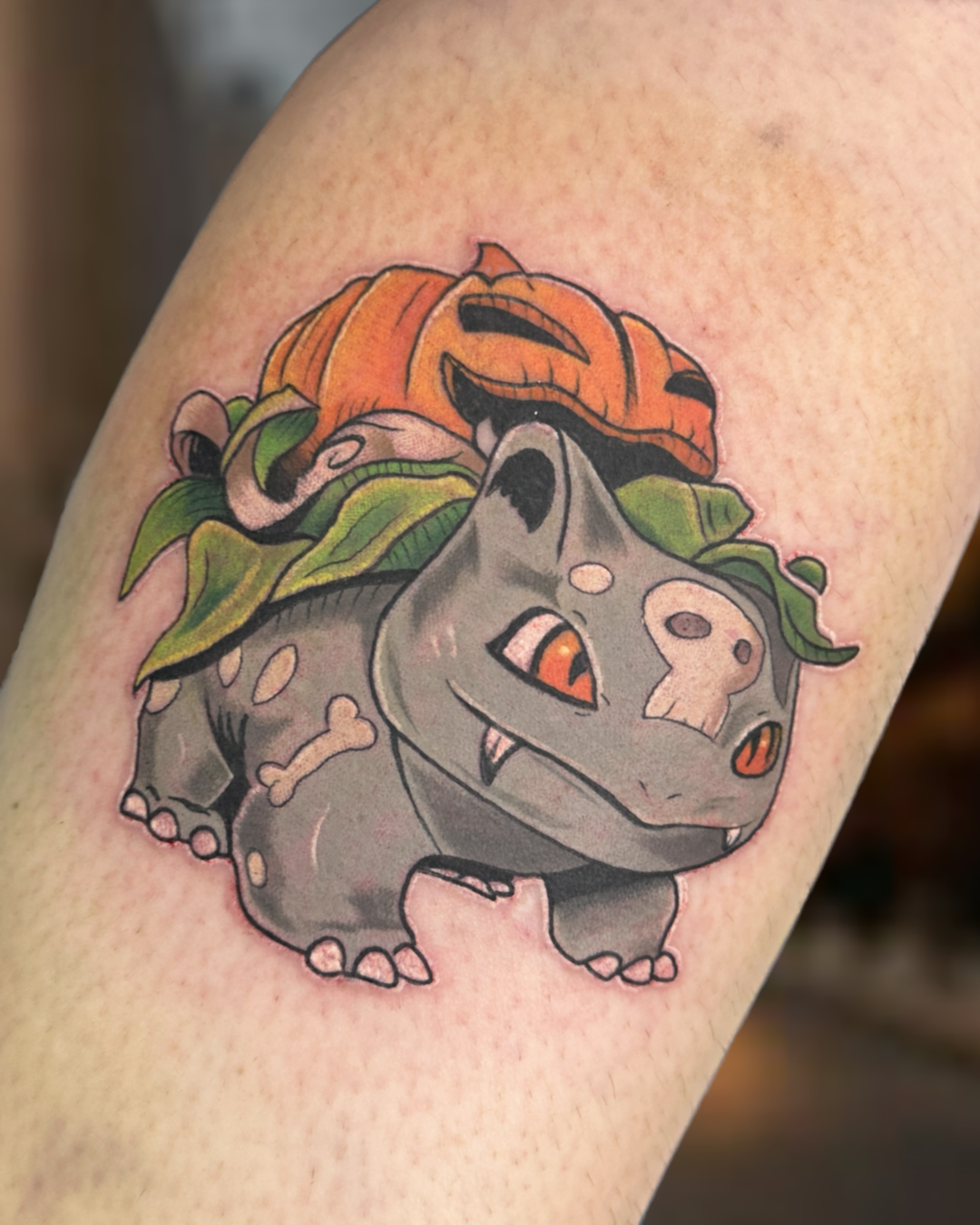 Color Bulbasaur Pokemon with Halloween jack-o-lantern tattoo