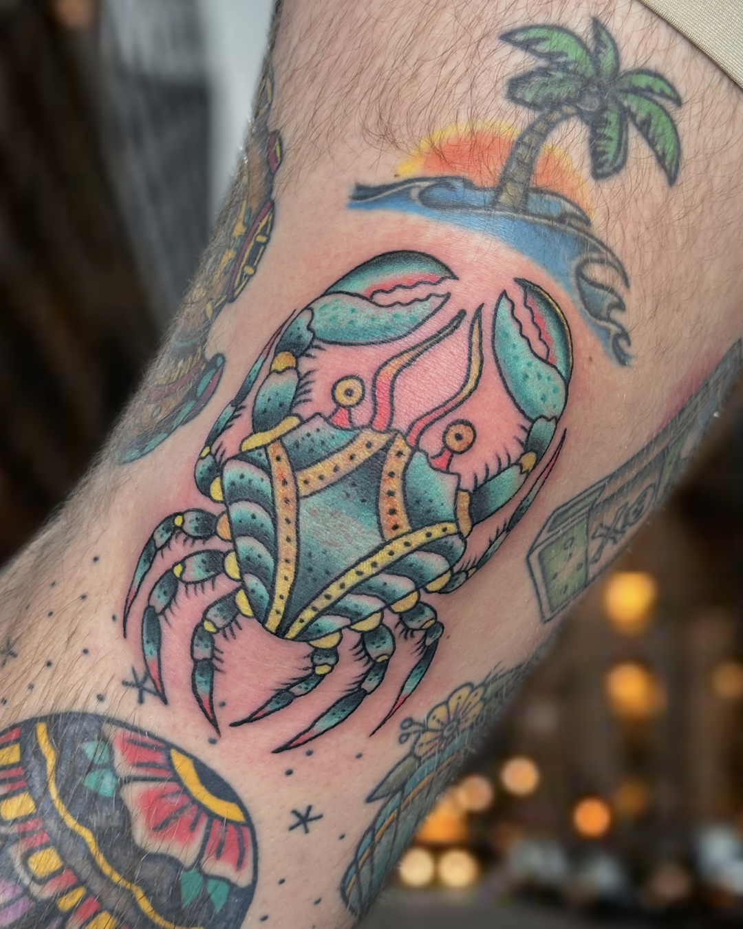 Traditional color crab tattoo with teal and yellow