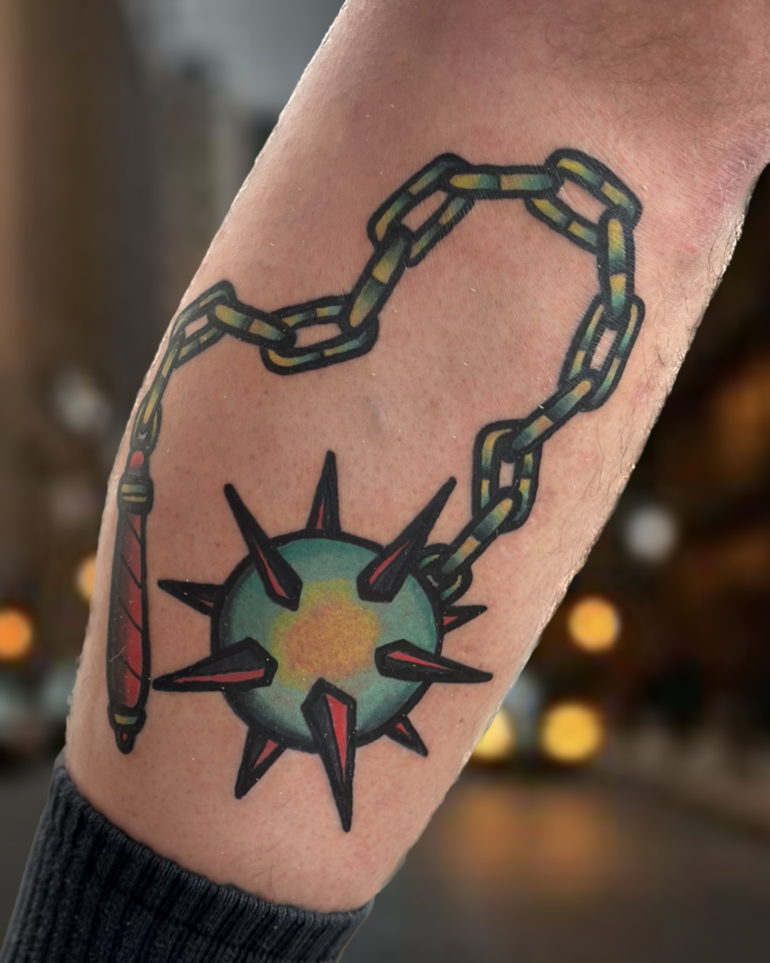 Traditional color flail weapon tattoo