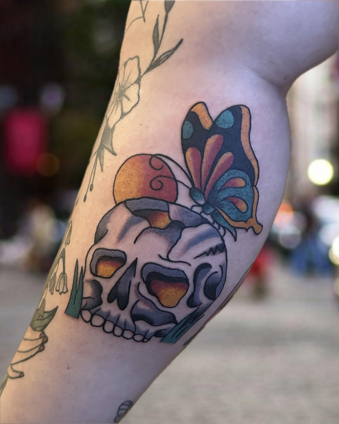 Traditional color skull with butterfly and mushroom tattoo